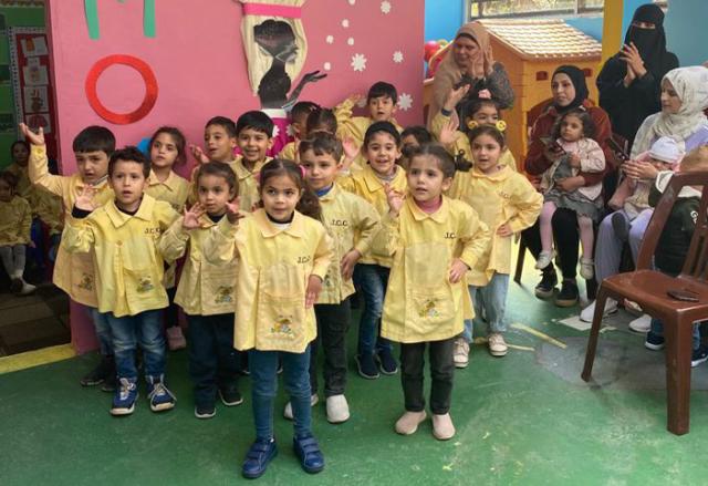 A group of children attending kindergarten class.