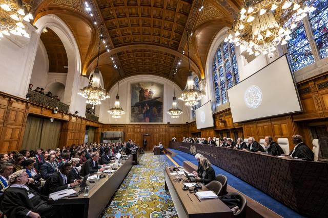 The court room of the International Court of Justice, with judges, plaintiffs, and lawyers present.