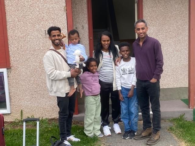 [The Eritrean family who arrived in summer 2023, in front of their new home in Whitehorse.]