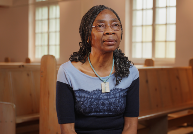 Albertine Chokoté Naoué sitting in a church pew