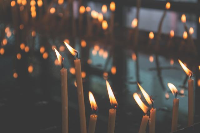 Multiple candles remind us to pray.