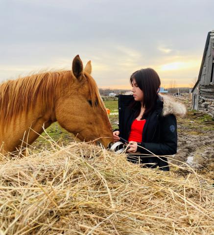 A woman with a horse in the equine therapy program