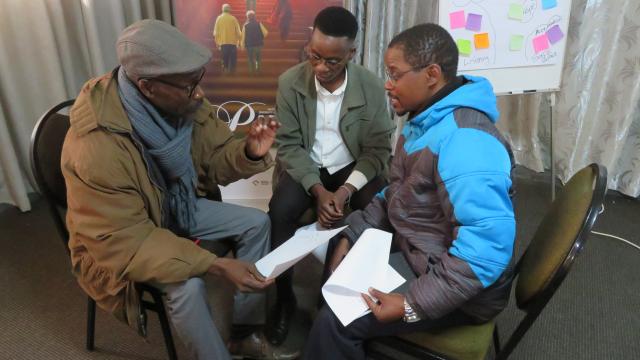 Participants in the Faith Beyond Borders workshop speaking together