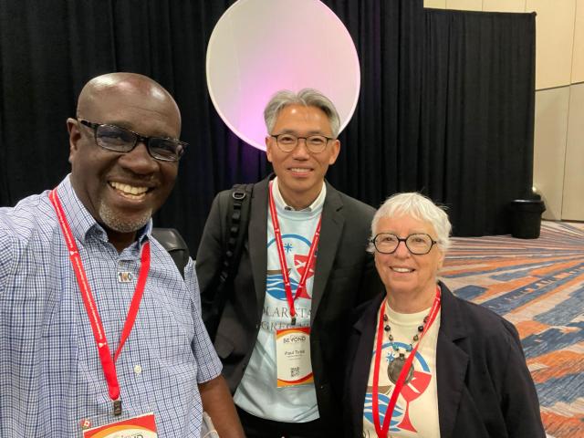 A group photo of three individuals.