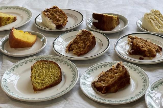 A table with plates of cake