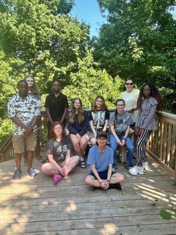 Youth climate motivators pose together outside.