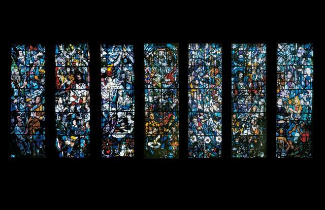 A wall featuring a seven-panel stained glass-window