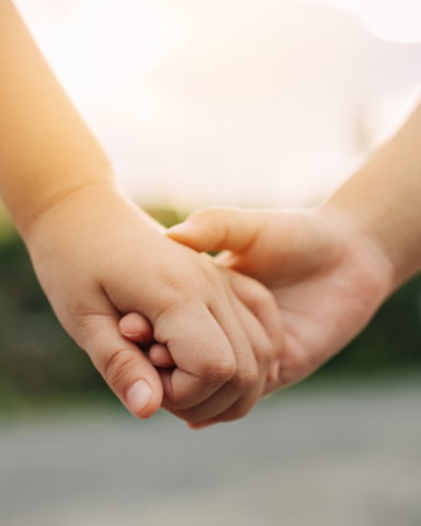 Two hands clasped together