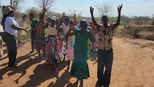A group of Africans raising their hands and dancing