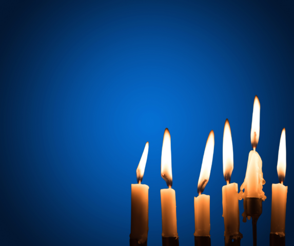 Candles burning with a blue background