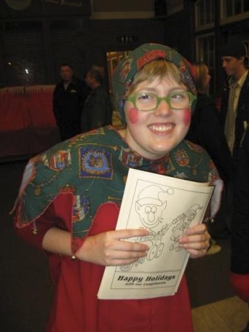 A young person in a Christmas costume