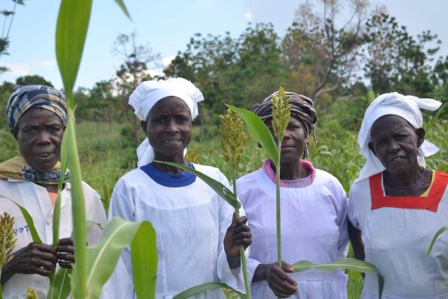 A group of smiling African women outdoors