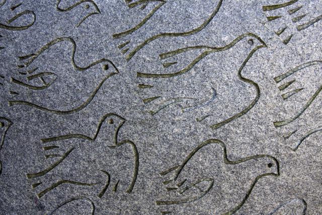 A drawing of doves in flight