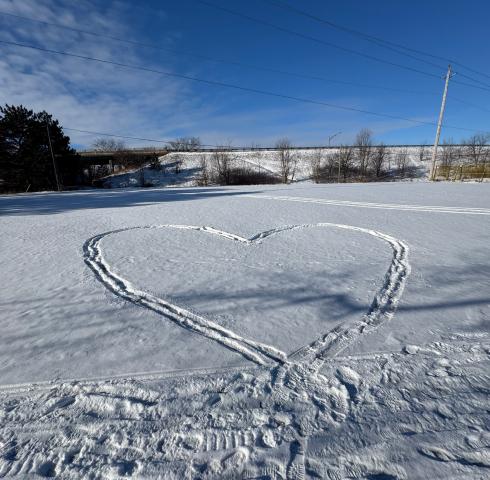 Tracks form a heart in the snow