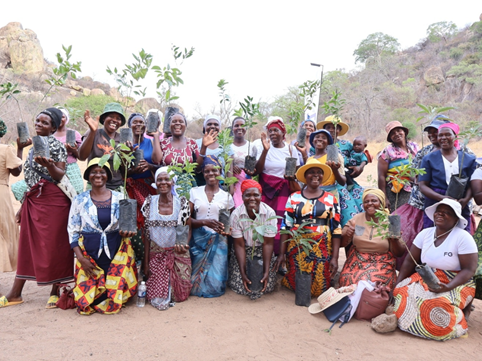 A group of smiling people outdoors in Zimbabwe