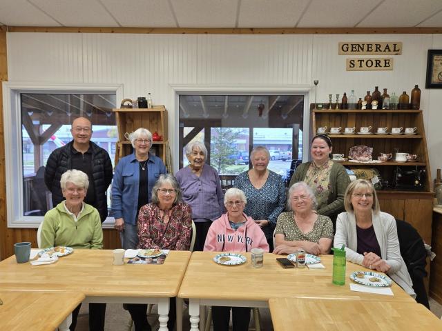 A group of smiling adults in a meeting room