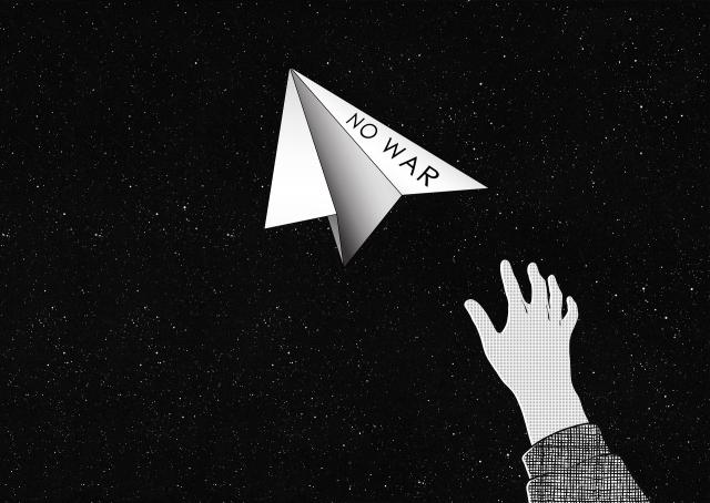 A hand throwing a paper airplane with the message "no war" written on it