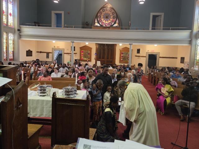 A group of children being baptised in a church