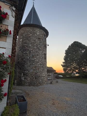 A medieval spire lit by sunset