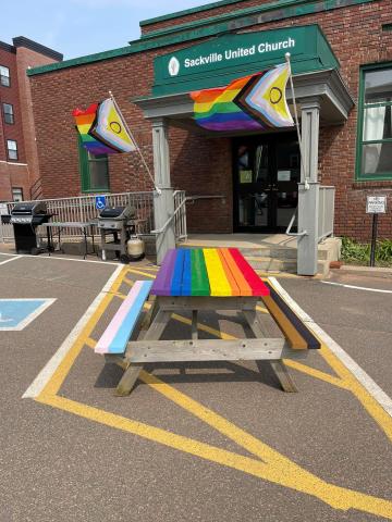 A rainbow picnic table outside Sackville United Church