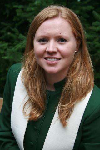 The author’s portrait from her first pastoral charge, Binkley United Church in Hamilton, ON. The author’s portrait from her first pastoral charge. She is a young woman with long blonde hair and is wearing a dark green jacket and white stole.
