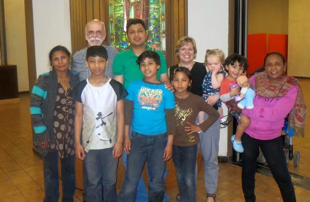 A diverse group of children and adults at Knox United Church.