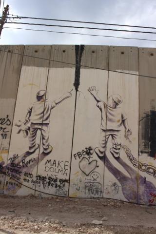 Separation wall graffiti in occupied Palestinian territory Photo of graffiti on separation wall, occupied Palestine