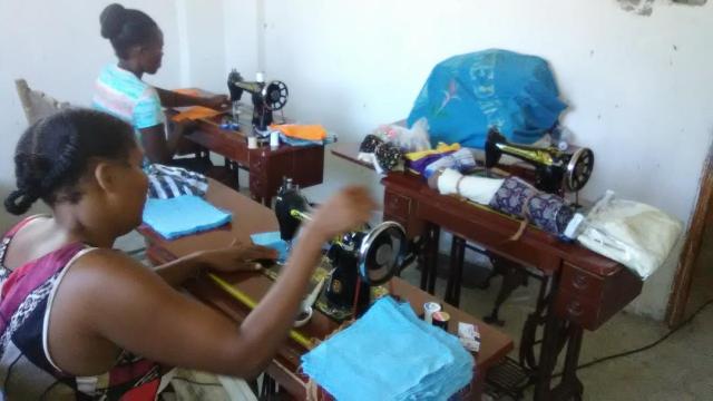 Haitians sew face masks during COVID-19.