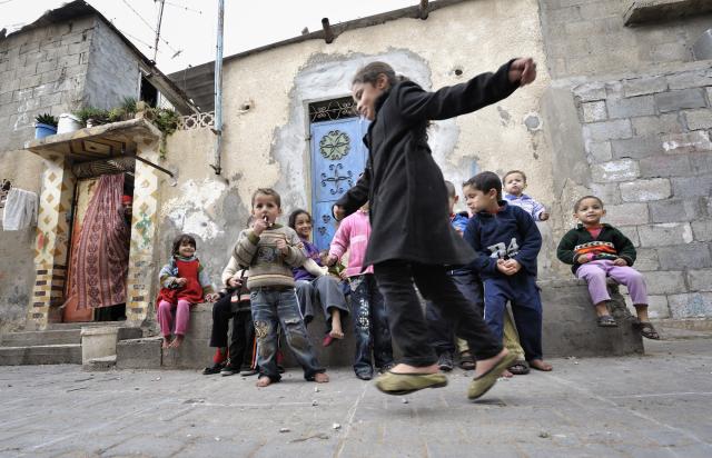 Children play in the Nuseirat refugee camp in the middle of the Gaza strip. Children playing outdoors