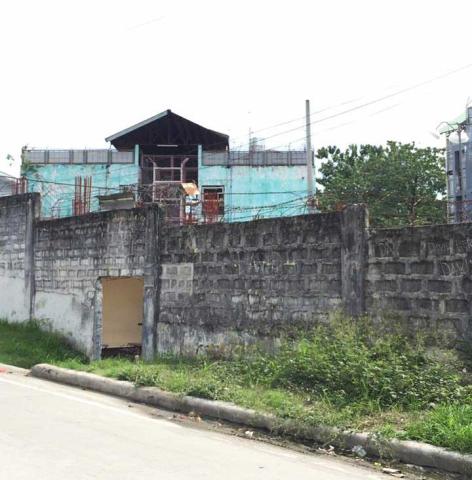 A maximum security prison in the Philippines, ringed with barbed-wire.