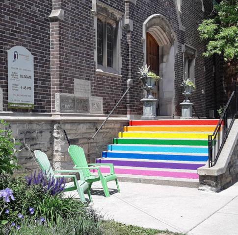 The steps of Roncesvalles United Church, Toronto in June 2018. Steps at Roncesvalles United Church are painted with the colours of the rainbow to remind people of the church's radical welcome.