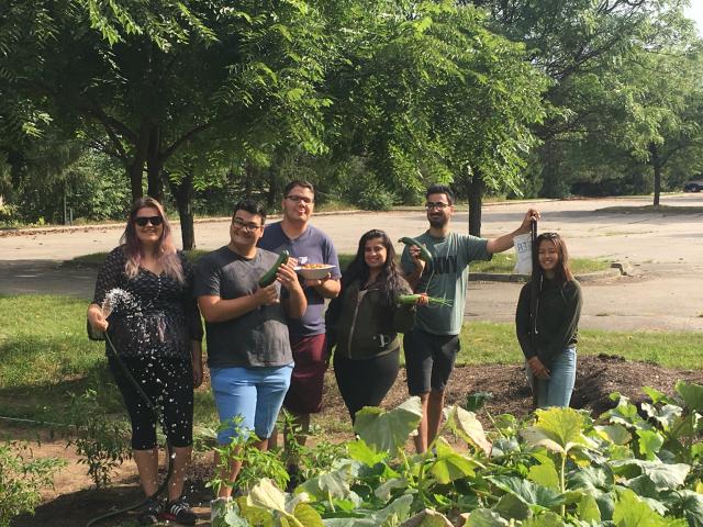 Summer Grant Students at Siloam United Church show off their work from the community garden.