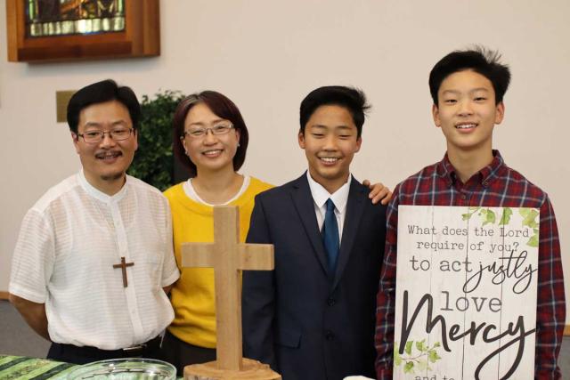 The author, SunDo Hyun, and family
