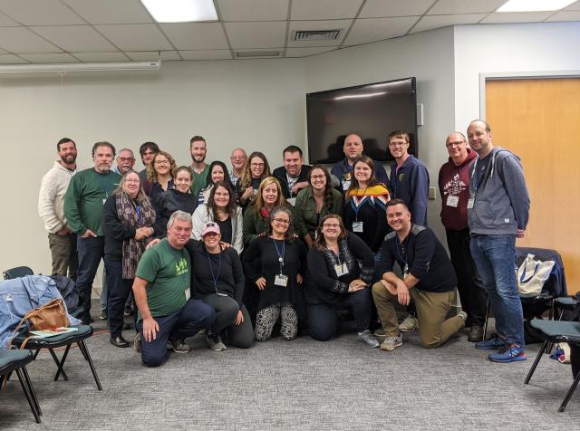 A group shot of United Church participants at The Great Gathering, showing about two dozen camp leaders, from young to middle age.