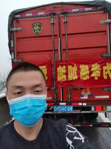 Yan Li took this selfie in front of his truck the day he delivered supplies to Hubei. Yan Li delivers COVID supplies to Hubei Province, China