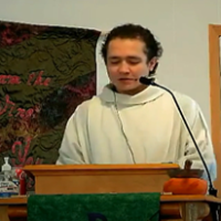 Shane Goldie speaking at church pulpit