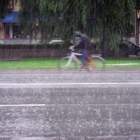 cyclist riding in downpour