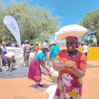 A woman receives food assistance in Zimbabwe