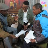 Participants in the Faith Beyond Borders workshop speaking together