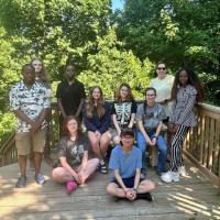 Youth climate motivators pose together outside.