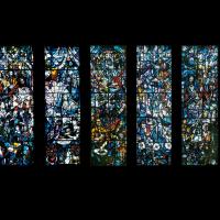 A wall featuring a seven-panel stained glass-window