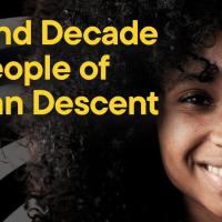 A girl smiling, with the text "Second Decade for People of African Descent"