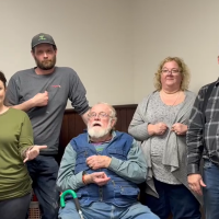 A group of five people demonstrating American Sign Language