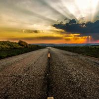 A sunset over a highway
