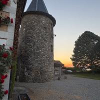 A medieval spire lit by sunset