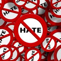 The word hate crossed out with red bar